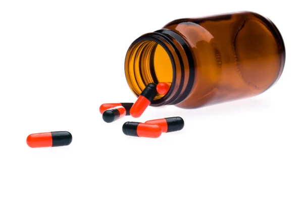 Jedna lahev vylila pills — Stock fotografie