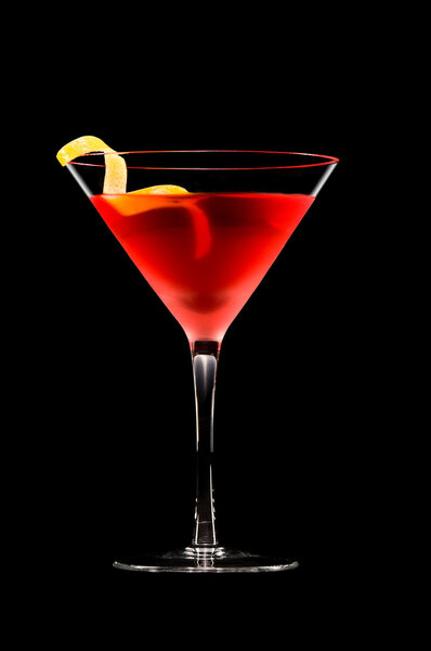 Cosmopolitan cocktail in front of a black background