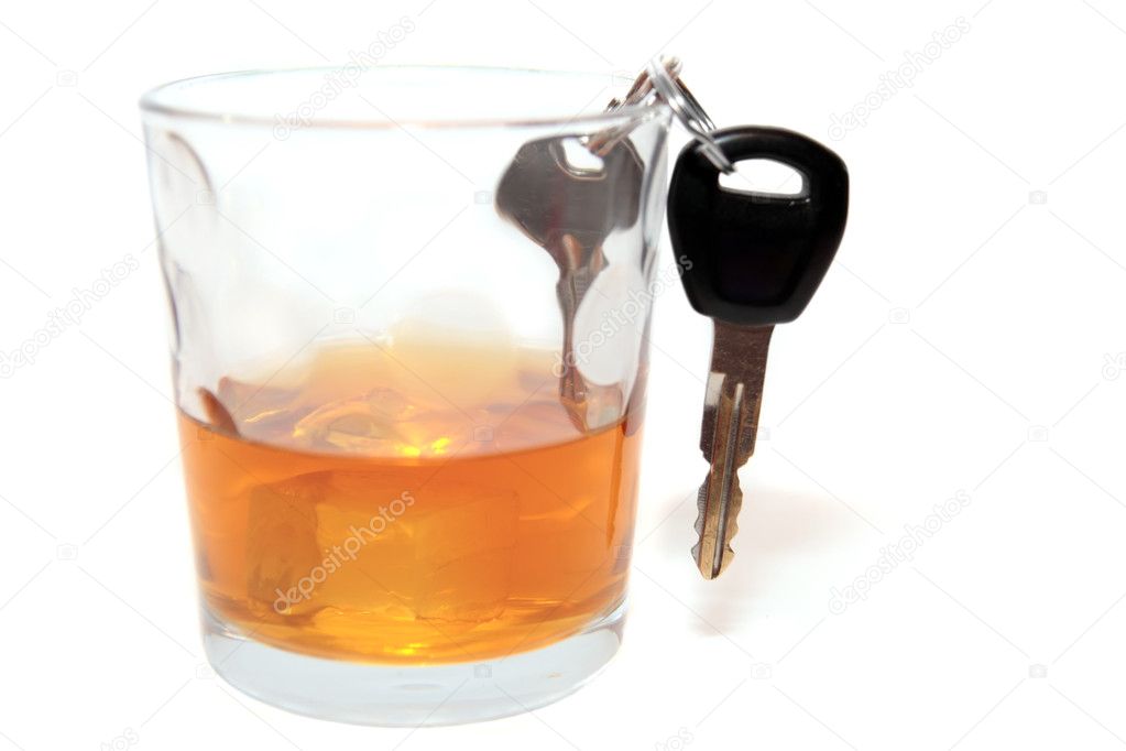 Car keys inside whiskey glass