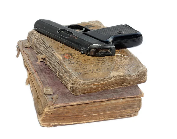 Пистолет и библия — стоковое фото