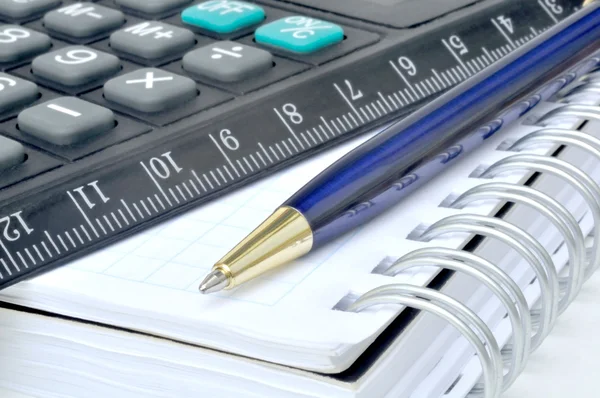 Calculator and notebook — Stock Photo, Image