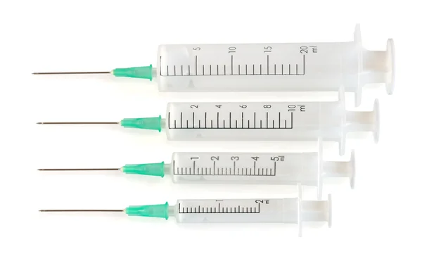 Quatro seringas descartáveis — Fotografia de Stock
