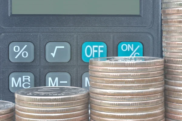 Calculator and coins — Stock Photo, Image