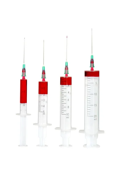 Čtyři jednorázové injekční stříkačka — Stock fotografie