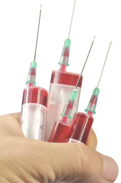 Quatro seringas descartáveis — Fotografia de Stock