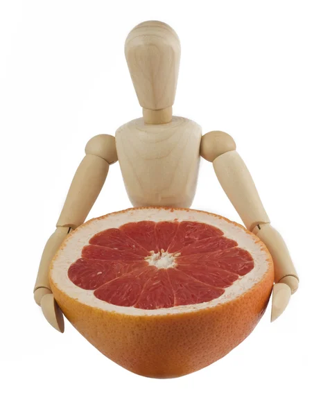 stock image Wooden mannequin with a grapefruit