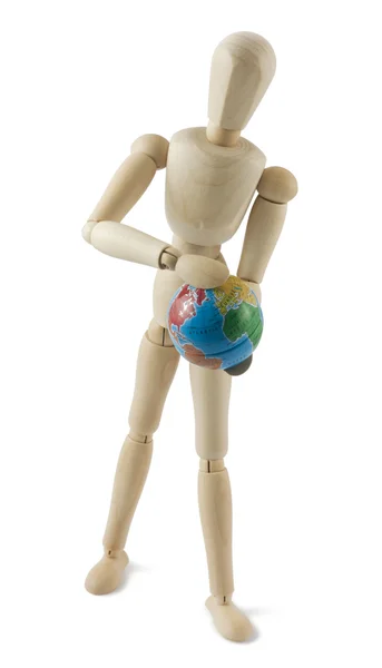 Wooden mannequin with a globe in hands — Stock Photo, Image