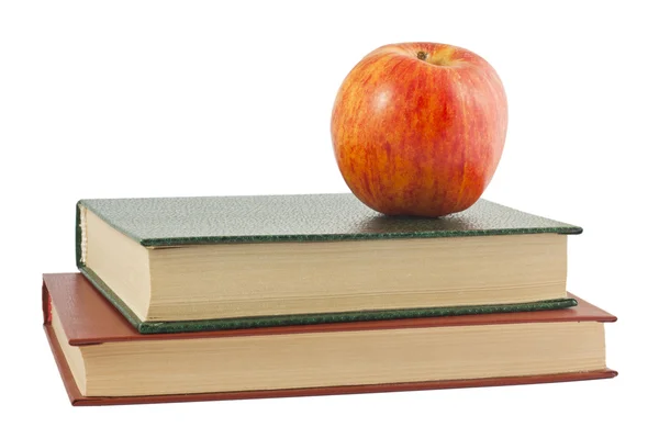 Manzana roja en los libros — Foto de Stock