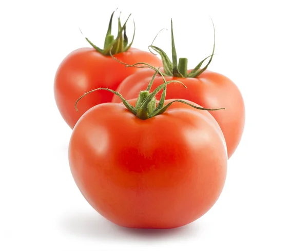 Три спелых помидора — стоковое фото