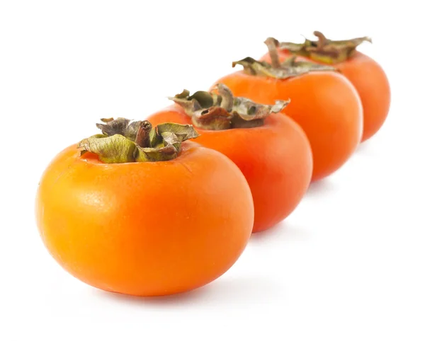Four persimmons — Stock Photo, Image