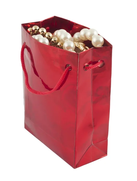 Red giftbag with jewelry — Stock Photo, Image