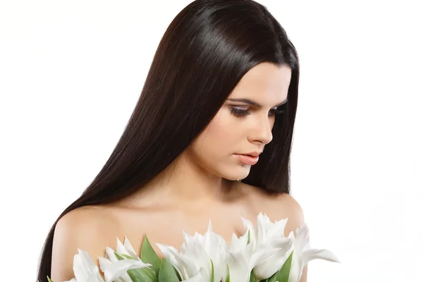 Beautiful young girl with tulips — Stock Photo, Image