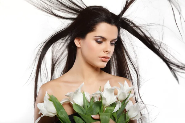 Mooi meisje met tulpen — Stockfoto