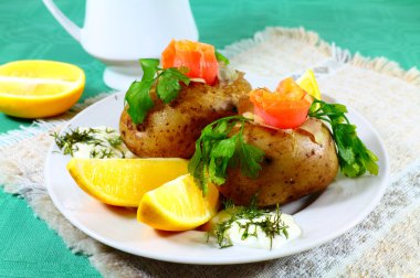 Tasty potatoes with salmon and lemon clipart