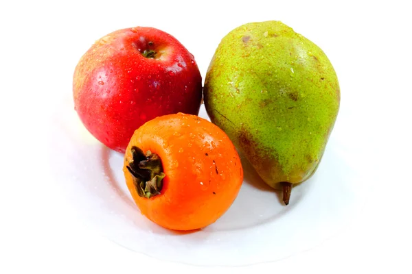 Frutas no prato branco — Fotografia de Stock