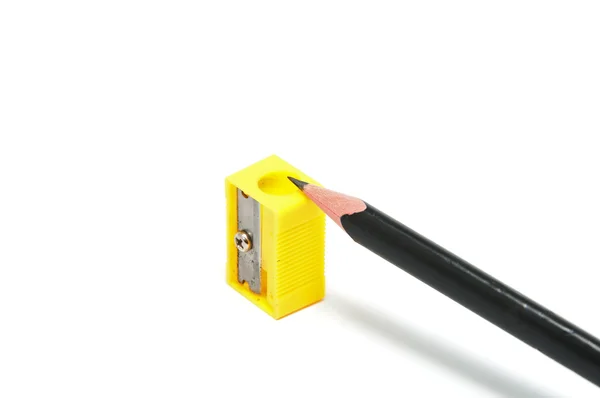 stock image Yellow sharpener and black pencil