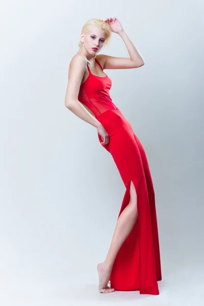 Attractive blond girl in red dress — Stock Photo, Image