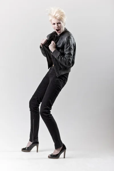 Affective scream blond girl in black leather — Stock Photo, Image
