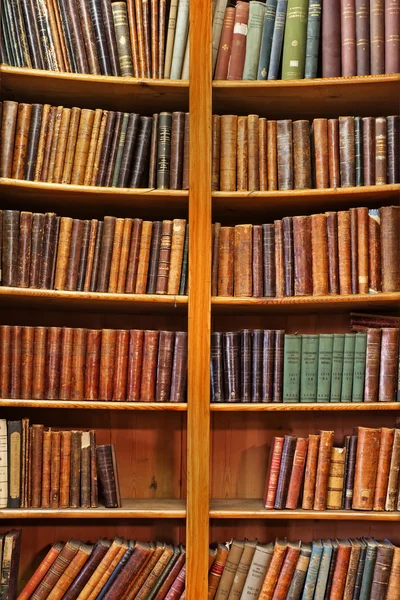 stock image Shelf of old books