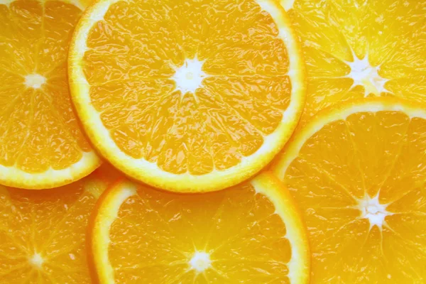 Orange sliced pieces of background — Stock Photo, Image
