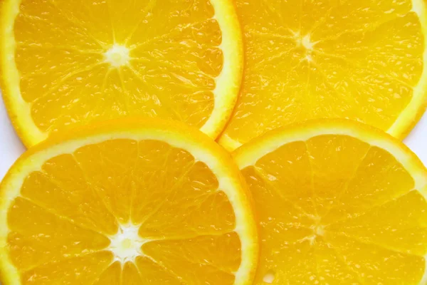 Fresh orange sliced pieces of background — Stock Photo, Image