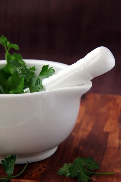 stock image Mortar and pestle with herbs