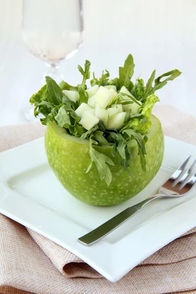 Arugula salad served in an apple — Stock Photo, Image