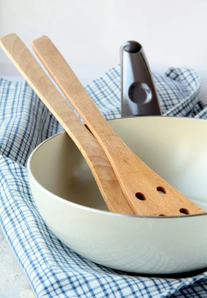 Pan with a wooden spoon — Stock Photo, Image