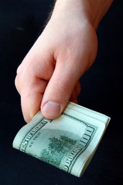 Man's hand with the U.S. dollar clipart