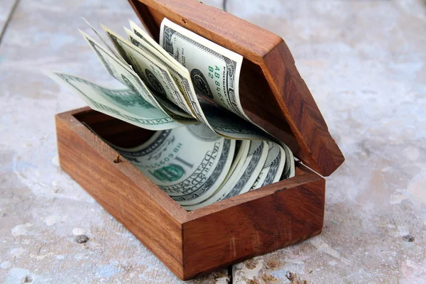 Wooden chest with the U.S. dollar — Stock Photo, Image