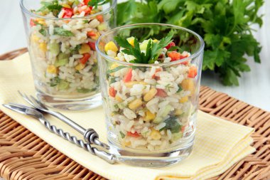 Salad with rice, parsley and vegetables in cups clipart