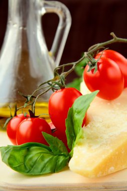 Parmesan cheese olive oil cherry tomatoes and basil Italian Still Life clipart
