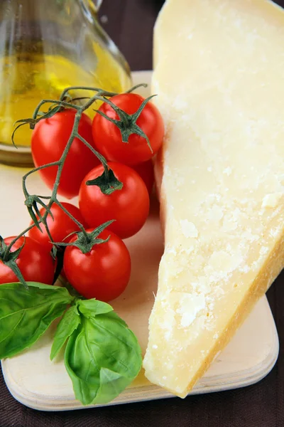 Parmesan cheese olive oil cherry tomatoes and basil — Stock Photo, Image