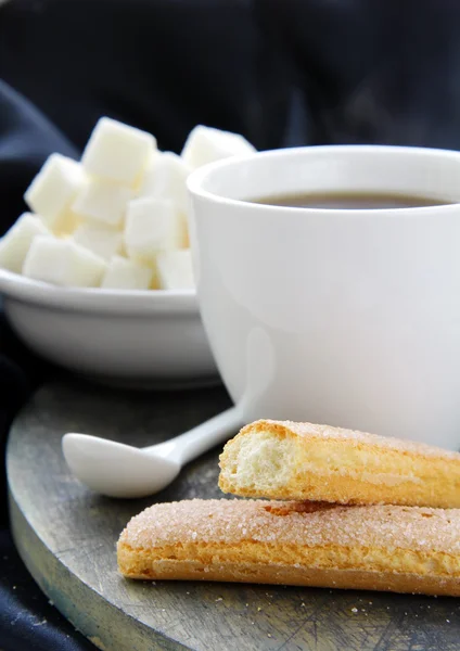 A cup of black coffee and refined sugar — Stock Photo, Image