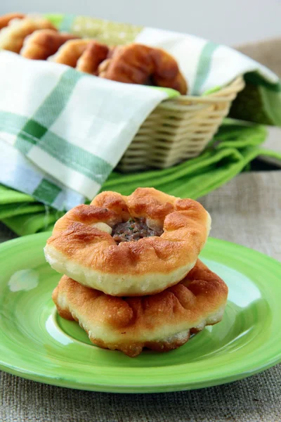 stock image Homemade fried pies with meat on the table