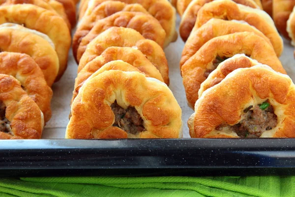 stock image Homemade fried pies with meat on the table