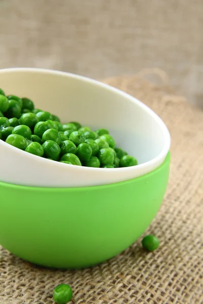 stock image Fresh green peas in a cup on the table