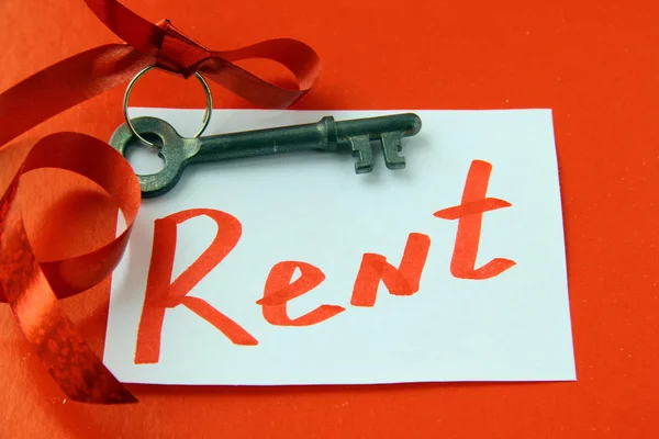 stock image Old key with a ribbon and with card