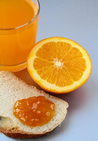 Orange, juice and toast with orange marmalade — Stock Photo, Image
