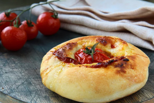 Italian Focaccia bread with tomato and cheese — Stock Photo, Image