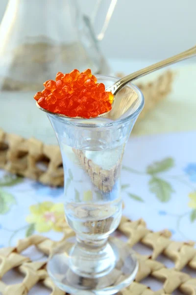 Russian vodka with a dollop of red caviar — Stock Photo, Image