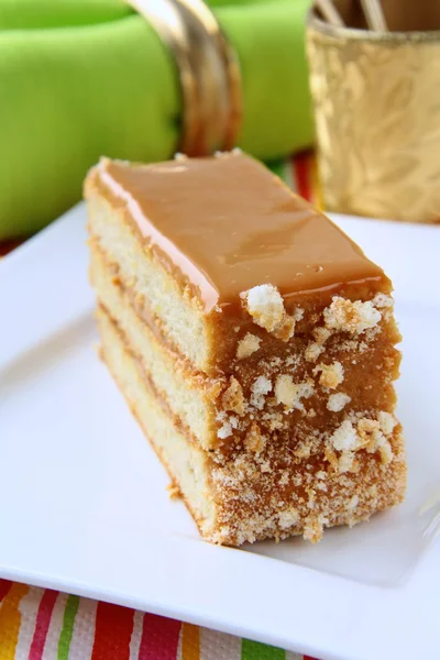 Piece of sweet cake with caramel cream — Stock Photo, Image