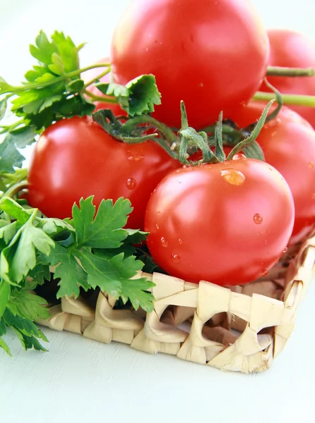 Fresh red tomatoes and parsley — Stock Photo, Image