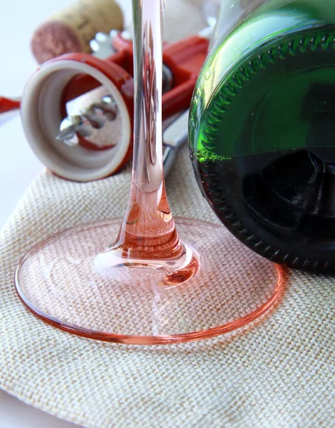Red wine, wine glass, a corkscrew — Stock Photo, Image