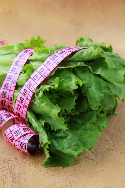 Green salad diet with a measuring tape — 스톡 사진