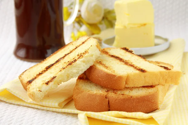Toast with butter and a cup of black coffee — Stock Photo, Image