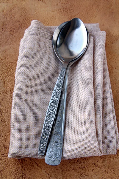 Old spoons and a napkin — Stock Photo, Image