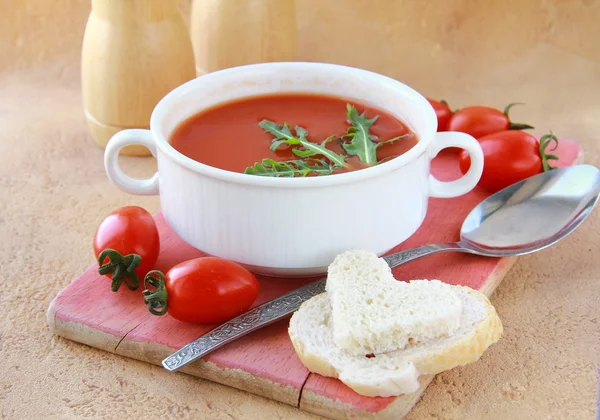 stock image Tomato soup in a white bowl with arugula