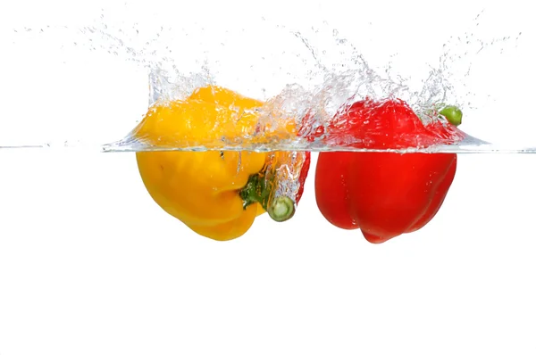 Red and yellow Bell Pepper splashing — Stock Photo, Image