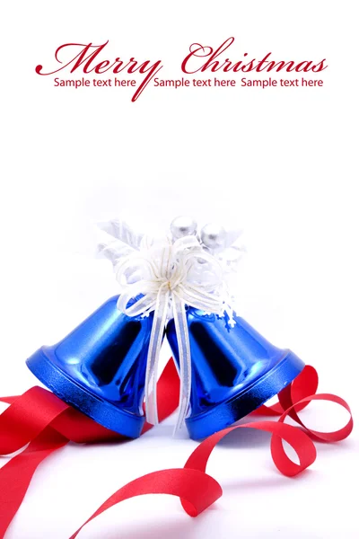 Blue christmas bells and red bow ribbon — Stock Photo, Image